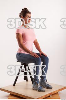 Sitting pose blue jeans pink t shirt of Oxana …